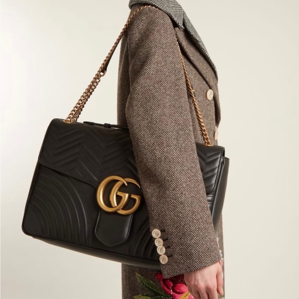 Gucci Black and Gold Women's Bag
Does Not come with original dust bag or box